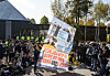 Members of an organization representing families of North Korean abductees look at a drone holding a poster denouncing the Kim Jong-un regime in Paju’s Imjingak area, Gyeonggi, on Thursday morning after canceling its plan to float anti-Pyongyang leaflets across the inter-Korean border. [NEWS1]