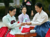 People dressed in hanbok, or traditional Korean clothes, participate in a traditional coming-of-age ceremony at the National Folk Museum of Korea in central Seoul on Monday to celebrate the annual Hanbok Culture Week. The Ministry of Culture, Sports and Tourism will continue to offer diverse hanbok-related exhibitions, experiences and fashion shows through next Sunday. [NEWS1]