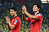 Cho Gue-sung, right, and Kim Young-gwon applaud fans on Monday after a round of 16 match against Brazil held at Stadium 974 in Doha, Qatar as Korea are eliminated from the World Cup. [REUTERS/YONHAP]