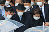 Former President Chun Doo Hwan, center, walks out of the Gwangju District Court accompanied by his wife after the court found him guilty of defaming a priest who was an eye witness to the military crackdown on pro-democracy demonstrators in Gwangju in 1980. [NEWS1]