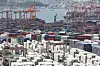 Containers are stacked high at the Sinseondae Terminal of Busan Port. [NEWS1]