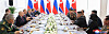 Russian President Vladimir Putin, center left, speaks to North Korean leader Kim Jong-un, center right, during a state reception dinner held after Wednesday's summit at Vostochny Cosmodrome in Amur Oblast, Russia. [KOREAN CENTRAL NEWS AGENCY]