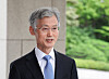 Supreme Court Chief Justice Jo Hee-de answers reporters' questions as he arrives for work at the court in southern Seoul on Sept. 12. [YONHAP]