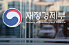 The Ministry of Economy and Finance logo is seen on the window of a building.  [YONHAP]