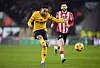 Wolverhampton Wanderers' Matheus Cunha, left, shoots during the Premier League match against Southampton at Molineux Stadium in Wolverhampton, England, on Saturday. [AP/YONHAP]