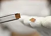 An LG Innotek employee showcases an RF-SiP module featuring the company’s new Cu-Post technology. [LG INNOTEK]