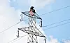 Staff from the Korea Electric Power Corporation (Kepco) repair a pylon in Nonsan, South Chungcheong, on Oct. 14, 2021. [JOONGANG ILBO]