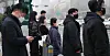 People wearing masks wait to cross the street in Jongno District, central Seoul, on Jan. 22. [NEWS1]