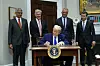 U.S. President Donald Trump signs an executive order aiming to lower the cost of prescription drugs during a press conference in the Roosevelt Room of the White House in Washington on May 12. [UPI/YONHAP]