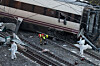 Members of the Spanish Civil Guard crime department work next to the trains involved in the accident, at the site of a deadly derailment of two high-speed trains near Adamuz, in Cordoba, Spain, on Jan. 19. [REUTERS/YONHAP]