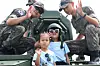 Children pose for photos with soldiers on an armed vehicle in an event to commemorate the 75th anniversary of Operation Chromite in Jung District, Incheon, on Sept. 14. [YONHAP]