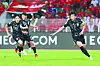 Korea's Son Heung-min, right, celebrates during a 2026 World Cup qualifier against Oman at Sultan Qaboos Sports Complex in Oman on Sept. 10. [YONHAP]
