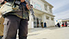 A Pakistani security official stands guard outside the hospital as a policeman who was escorting a polio vaccination team near the Afghan border is rushed to a local hospital after unknown militants opened fire at a polio vaccination team, killing a police guard, in Chaman, Pakistan, on Feb. 6. [EPA/YONHAP]