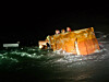 Crew members wait for rescue on top of a capsized fishing boat near Cheollipo, Taean County, South Chungcheong, at around 6:20 p.m. on Dec. 4. [TAEAN COAST GUARD]