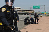 Police officers contain a protester who disrupted traffic on the 101 freeway on June 10 in Los Angeles, California. [AFP/YONHAP]