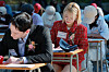 Participants focus intently on the questions during a Hangul dictation contest held at Gyeongbok Palace in Jongno District, central Seoul, on Oct 4. [NEWS1]