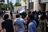 Reporters wait outside the West Kowloon Magistrates' Courts building ahead to hear appeals from 13 jailed pro-democracy activists in Hong Kong on July 14. [REUTERS/YONHAP]