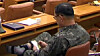 A two-star general of the Air Force plays a mobile game on his phone during recess at the National Defense Committee meeting at the National Assembly complex in Yeouido, western Seoul on Tuesday. [SCREEN CAPTURE]