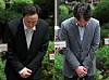 TMON CEO Ryu Kwang-jin, left, and WeMakePrice CEO Ryu Hwa-hyeon bow their heads to apologize for the ongoing liquidity crunch at the online marketplaces before attending hearings at the Seoul Bankruptcy Court in western Seoul on Friday. [NEWS1]