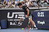 China's Wu Yibing returns between his legs against the United States' Taylor Fritz during the finals of the Ultimate Tennis Showdown in July in Carson, Calif. [AP/YONHAP]