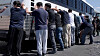 Detainees are made to stand against a bus before being handcuffed, during a raid by federal agents where about 300 Koreans were among 475 people arrested at the site of a $4.3 billion project by Hyundai Motor and LG Energy Solution to build batteries for electric cars in Ellabell, Georgia, on Sept. 4. [REUTERS/YONHAP]