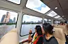 Passengers enjoy the river view during a trial ride on the Hangang Bus on July 1. [YONHAP]