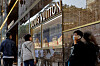 People walk past a Louis Vuitton store in Tsim Sha Tsui, a bustling shopping hotspot, in Hong Kong on Dec. 5, 2023. [REUTERS/YONHAP]