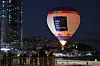 A hot air balloon to promote Busan's bid to host the 2030 World Expo floats at Haeundae beach in Busan on Saturday. [YONHAP]
