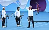Korean archer Kim Jong-ho, right, competes in the compound men's team gold medal match against India at Fuyang Yinhu Sports Centre Final Field in Hangzhou, China on Thursday. [YONHAP]
