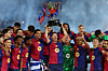 FC Barcelona forward Robert Lewandowski lifts the La Liga trophy after winning the league title at Estadi Olimpic Lluis Companys in Barcelona on May 18. [REUTERS/YONHAP]