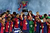 FC Barcelona forward Robert Lewandowski lifts the La Liga trophy after winning the league title at Estadi Olimpic Lluis Companys in Barcelona on May 18. [REUTERS/YONHAP]