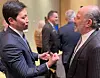 Coupang founder and CEO Bom Kim talks to U.S. Commerce Secretary nominee Howard Lutnick on Jan. 18 [JOINT PRESS CORPS]