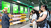 An Olive Young employee explains a product to customers at one of the store's branches. [OLIVE YOUNG]
