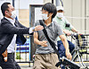 Tetsuya Yamagami, center, holding a weapon, is detained near the site of gunshots in Nara, western Japan on July 8, 2022. Yamagami was found guilty of assassinating former Prime Minister Shinzo Abe by opening fire on at him from behind as he delivered a campaign speech, an attack that stunned a nation that has some of the world’s toughest gun laws.  [AP/YONHAP]