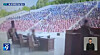 Hundreds of people are seen seated for a public trial at an open-air theater in North Korea in this image captured from KBS footage. [SCREEN CAPTURE]