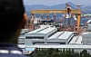 A large crane stands at Hanwha Ocean’s headquarters in Geoje, South Gyeongsang, on July 31, the day when the United States cut its tariffs on Korean goods to 15 percent. [YONHAP]