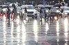 Commuters hurry across Gwanghwamun Intersection in Jongno District, central Seoul, on Aug. 13 as a heavy rain advisory is in effect for the capital. [NEWS1]