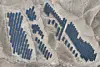 An aerial view of solar panels on barren mountains in Haiyuan County, Zhongwei, in northern China's Ningxia province on Nov. 6 [AFP/YONHAP]