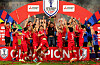 Vietnamese national team manager Kim Sang-sik, center, lifts the Mitsubishi Electric Cup trophy after winning the final against Thailand at Rajamangala National Stadium in Thailand on Jan. 5. [AFP/YONHAP]
