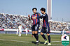 Suwon FC's Lee Seung-woo, left, celebrates scoring a goal in a K League match against Jeonbuk Hyundai Motors at Suwon Sports Complex in Suwon, Gyeonggi on Saturday. [K LEAGUE]