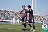 Suwon FC's Lee Seung-woo, left, celebrates scoring a goal in a K League match against Jeonbuk Hyundai Motors at Suwon Sports Complex in Suwon, Gyeonggi on Saturday. [K LEAGUE]