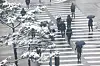 Pedestrians cross a street near Eulji-ro Station in Jung District, central Seoul, on March 18. [YONHAP]