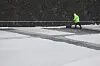 Maintenace staff shovel snow at Gwanghwamun Square in Jongno District, central Seoul, on March 18. [YONHAP]