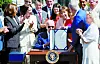 U.S. President Joe Biden signs the CHIPS and Science Act in 2022 alongside Vice President Kamala Harris and House of Representatives Speaker Nancy Pelosi on the South Lawn of the White House in Washington. [REUTERS]