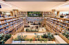 The “Book Stair” at Starfield Village Unjeong in Paju, Gyeonggi, is an open, double-height bookshelf spanning the first and second floors, filled with more than 36,000 books. [SHINSEGAE PROPERTY]