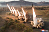 In this photo released by Pyongyang's state-controlled Korean Central News Agency (KCNA) on Tuesday, six missiles are fired from multiple launch rocket systems during a drill that took place at an unspecified location the previous day. [YONHAP]