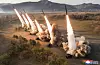 In this photo released by Pyongyang's state-controlled Korean Central News Agency (KCNA) on Tuesday, six missiles are fired from multiple launch rocket systems during a drill that took place at an unspecified location the previous day. [YONHAP]