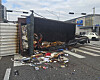 A garbage truck lies overturned at an intersection near Sinmokdong Station on Seoul Subway Line 9 in Yangcheon District, western Seoul, on Jan. 6. [YONHAP]