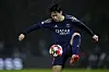 Paris Saint-Germain midfielder Lee Kang-in controls the ball during the UEFA Champions League match against Manchester City at the Parc des Princes in Paris on Jan. 22. [AP/YONHAP]