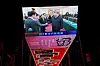 A giant screen shows Chinese President Xi Jinping shaking hands with DeepSeek founder Liang Wenfeng during a symposium on private enterprises at a shopping complex in Beijing on Feb. 17. [REUTERS/YONHAP]